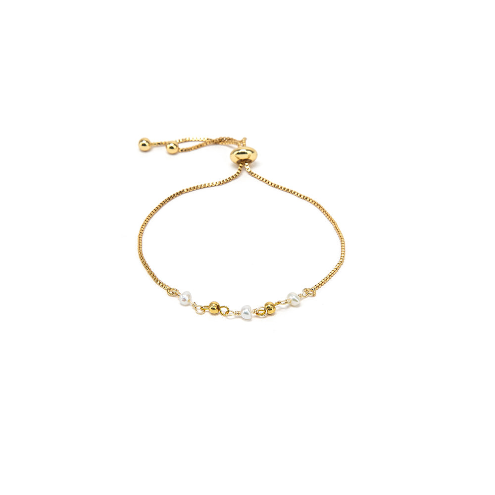 BRACCIALE REGOLABILE SFERE E PERLE GOLD